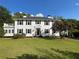 Charming two-story home with a manicured lawn and mature trees providing curb appeal at 6104 Floyd St, Covington, GA 30014