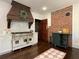 Well-appointed kitchen featuring an industrial-style stove, modern appliances, and brick accents at 6104 Floyd St, Covington, GA 30014