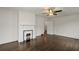 Spacious living room with fireplace, hardwood floors, and natural light, creating a cozy atmosphere at 6104 Floyd St, Covington, GA 30014