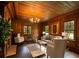 Cozy living room featuring rich wood trim, a fireplace, and plush seating, creating an intimate and welcoming space at 6104 Floyd St, Covington, GA 30014