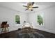 Bright office offers windows, wood floors, paneled walls and great space for working at home at 6104 Floyd St, Covington, GA 30014