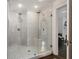Luxurious glass shower with tiled walls and double shower heads, creating a spa-like experience at 6104 Floyd St, Covington, GA 30014