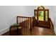 Classic staircase features stained wood details and a window with a backyard view at 6104 Floyd St, Covington, GA 30014