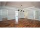 Basement with hardwood floors, recessed lighting and white trim with multiple entryways at 704 Willowwind Dr, Loganville, GA 30052
