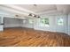 Spacious basement featuring hardwood floors, white trim, recessed lighting and ample natural light at 704 Willowwind Dr, Loganville, GA 30052