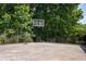 Private basketball court surrounded by lush trees at 704 Willowwind Dr, Loganville, GA 30052