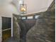 Bathroom with an ornate, stone walk-in shower and modern fixtures at 704 Willowwind Dr, Loganville, GA 30052