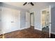 Spacious bedroom featuring hardwood floors and access to primary bathroom at 704 Willowwind Dr, Loganville, GA 30052