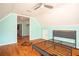 Spacious bedroom featuring hardwood floors, complemented by a ceiling fan at 704 Willowwind Dr, Loganville, GA 30052