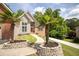 Beautiful home exterior with manicured landscaping and stone planters at 704 Willowwind Dr, Loganville, GA 30052