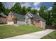 Charming two-story home with brick and siding, and a well-manicured lawn at 704 Willowwind Dr, Loganville, GA 30052