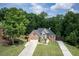 Beautiful two-story home with brick accents, a lush lawn, and a long driveway at 704 Willowwind Dr, Loganville, GA 30052