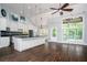Bright kitchen with granite counters, large island, and stainless steel appliances at 704 Willowwind Dr, Loganville, GA 30052