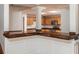 Kitchen view from living area with hardwood countertop, white trim, and stainless appliances at 704 Willowwind Dr, Loganville, GA 30052