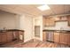 Basement kitchenette with stainless steel dishwasher and ample cabinetry at 704 Willowwind Dr, Loganville, GA 30052