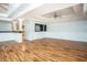 Expansive living room boasts hardwood floors, recessed lighting, and access to the kitchen at 704 Willowwind Dr, Loganville, GA 30052