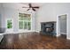 Bright and spacious living room with a stone fireplace and soaring ceilings at 704 Willowwind Dr, Loganville, GA 30052