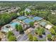 Aerial view of the neighborhood, featuring a pool, tennis courts, and a pond at 337 Liberty Dr, Acworth, GA 30102