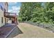 Spacious backyard features a lovely lawn and attractive wood privacy fence at 337 Liberty Dr, Acworth, GA 30102