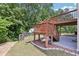 Outdoor patio with stairs leading up to a deck, plus a small grassy area at 337 Liberty Dr, Acworth, GA 30102