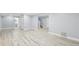 Finished basement with neutral walls, light-colored floors, and multiple doorways at 337 Liberty Dr, Acworth, GA 30102
