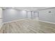 Spacious finished basement with light gray walls and wood-look vinyl plank flooring at 337 Liberty Dr, Acworth, GA 30102