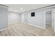 Finished basement featuring French doors, light gray walls, and wood-look vinyl plank flooring at 337 Liberty Dr, Acworth, GA 30102