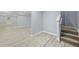 Finished basement featuring neutral walls, light-colored floors, and a staircase at 337 Liberty Dr, Acworth, GA 30102