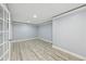 Spacious finished basement with light gray walls, white trim, and wood-look vinyl plank flooring at 337 Liberty Dr, Acworth, GA 30102