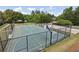 Outdoor basketball court featuring a full court, benches, and secure fencing in a well-maintained community at 337 Liberty Dr, Acworth, GA 30102