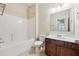 Bathroom featuring a bathtub, toilet, vanity with sink, and ceramic tile floor at 337 Liberty Dr, Acworth, GA 30102
