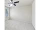 Bright bedroom featuring neutral walls, carpeted floor, window, and ceiling fan at 337 Liberty Dr, Acworth, GA 30102
