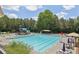 Resort-style community pool with a waterslide, seating, and shade umbrellas at 337 Liberty Dr, Acworth, GA 30102