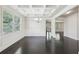 Elegant dining room with coffered ceiling, wainscoting, hardwood floors, and ample natural light at 337 Liberty Dr, Acworth, GA 30102