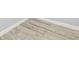 Close up of wood-look vinyl plank flooring with white baseboards and trim at 337 Liberty Dr, Acworth, GA 30102