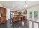 Beautiful kitchen with dark wood cabinets, granite countertops, and stainless appliances at 337 Liberty Dr, Acworth, GA 30102