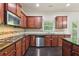 Well-equipped kitchen featuring stainless steel appliances and dark wood cabinetry at 337 Liberty Dr, Acworth, GA 30102