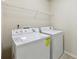 Laundry room featuring a washer, dryer, and wire shelving at 337 Liberty Dr, Acworth, GA 30102
