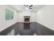 Spacious living room with hardwood floors, stone fireplace, and natural light from the window at 337 Liberty Dr, Acworth, GA 30102