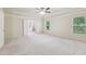 Airy main bedroom boasting trey ceilings, large windows, and ensuite bathroom entrance at 337 Liberty Dr, Acworth, GA 30102