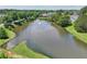 Scenic pond with a fountain surrounded by mature trees and lush landscaping, offering a peaceful community view at 337 Liberty Dr, Acworth, GA 30102