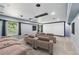 Home theater with tiered seating, projector screen, and dimmed lighting for an immersive entertainment experience at 337 Liberty Dr, Acworth, GA 30102