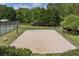 Sandy volleyball court surrounded by lush greenery, offering a recreational space for outdoor games and relaxation at 337 Liberty Dr, Acworth, GA 30102