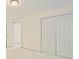 Spacious bedroom with walk-in closet, neutral walls, and hallway access at 12955 Mariners Ct, Alpharetta, GA 30005