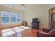 Sun-filled bedroom boasts hardwood floors and neutral decor at 12955 Mariners Ct, Alpharetta, GA 30005