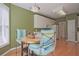 Breakfast nook features wooden floors, table, chairs, and a window at 12955 Mariners Ct, Alpharetta, GA 30005