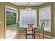 Bright breakfast nook with an open view and a stylish light fixture at 12955 Mariners Ct, Alpharetta, GA 30005