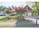 Beautiful home with a two-car garage, lush landscaping, and a charming front yard at 12955 Mariners Ct, Alpharetta, GA 30005