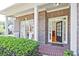 Charming front porch with brickwork, white columns, and 'Home Sweet Home' doormat at 12955 Mariners Ct, Alpharetta, GA 30005