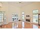 Spacious living room with vaulted ceilings, fireplace, hardwood floors, and large windows at 12955 Mariners Ct, Alpharetta, GA 30005